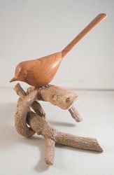 Long Tailed Tit carved in Yew displayed on a natural Branch